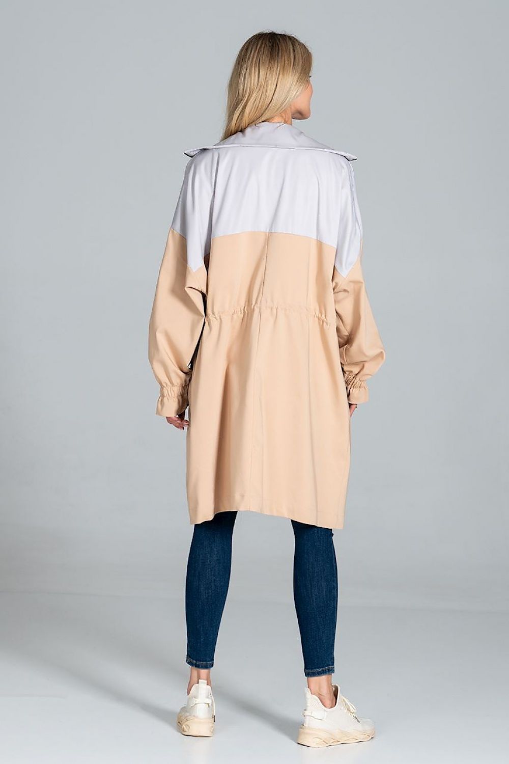 Woman wearing Ardevine two-tone autumn parka coat from the back, showing relaxed fit and elasticated sleeves.