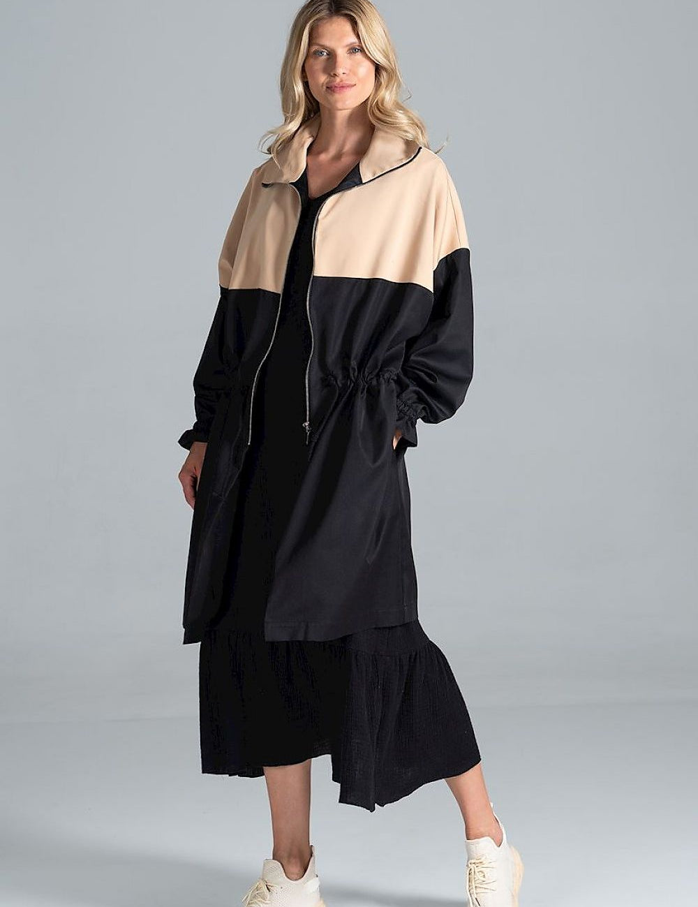 Woman wearing Ardevine Two-Tone Autumn Parka Coat with drawstring waist and elasticated sleeves, perfect for fall layering.