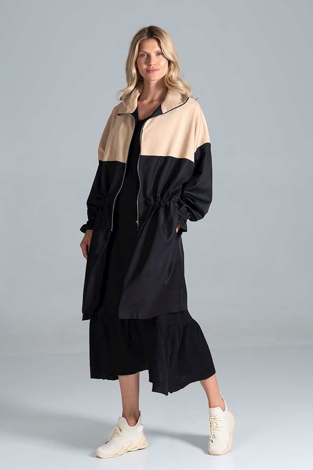 Woman wearing Ardevine Two-Tone Autumn Parka Coat with drawstring waist and elasticated sleeves, perfect for fall layering.