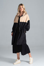 Woman wearing Ardevine Two-Tone Autumn Parka Coat with drawstring waist and elasticated sleeves, perfect for fall layering.
