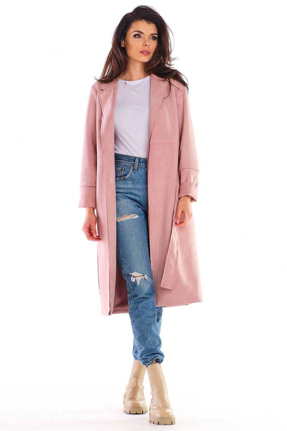 Woman wearing Sylverine Suede Belted Dressing Gown Coat in pink, paired with jeans and boots, showcasing its elegant, versatile design.