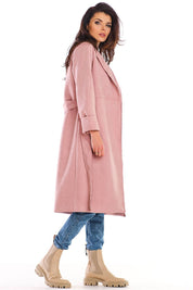 Woman wearing Sylverine suede-effect belted dressing gown coat in pink, showcasing elegant and versatile design, side profile view.