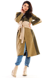 Woman wearing Auralenne long suede belted coat in autumn tones with jeans and boots. Flattering fit ideal for refined or casual events.