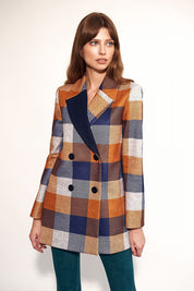 Woman wearing Maelvara checked double-breasted coat with notched collar, perfect for autumn style and elegance.