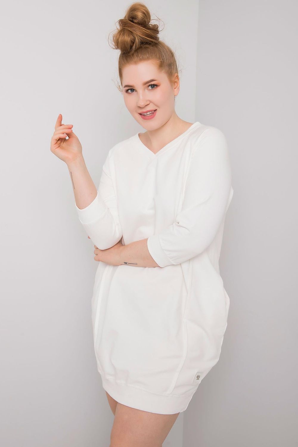 Woman wearing plus size Velissia cotton pocket dress with 3/4 sleeves, showcasing a comfortable and elegant design.