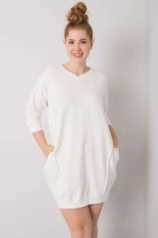 Plus Size Velissia Cotton Pocket Dress with 3/4 sleeves, model in elegant white cotton blend fabric, showcasing the side pockets.