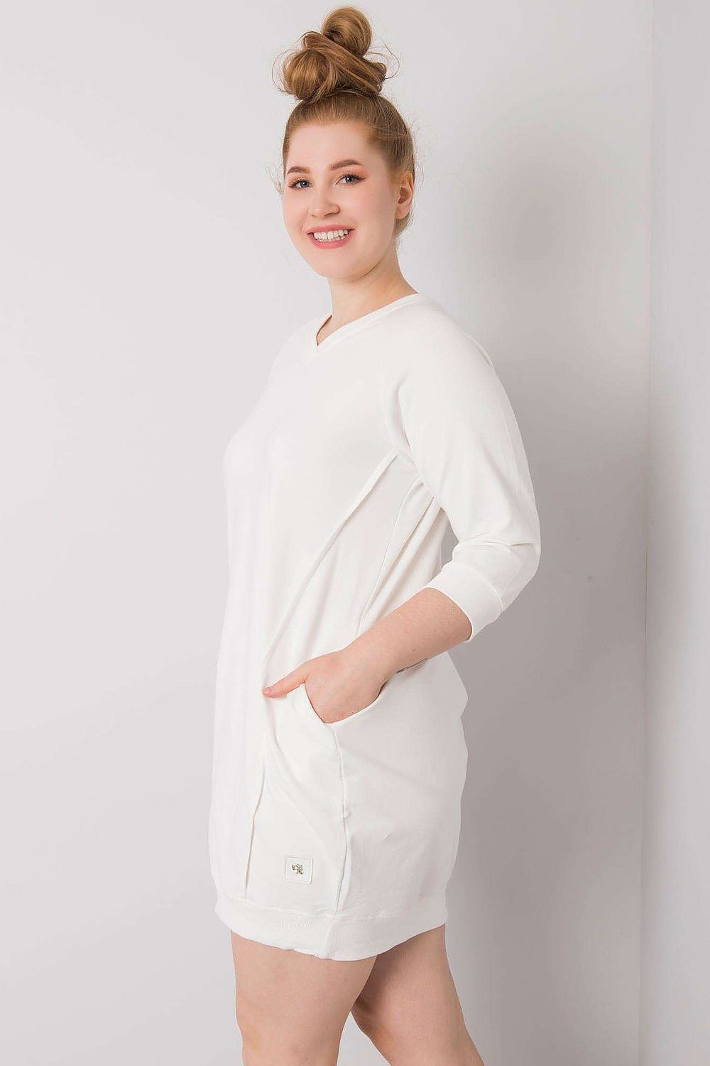 Woman wearing Plus Size Velissia Cotton Pocket Dress with 3/4 sleeves and side pockets.