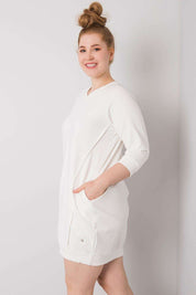 Woman wearing Plus Size Velissia Cotton Pocket Dress with 3/4 sleeves and side pockets.