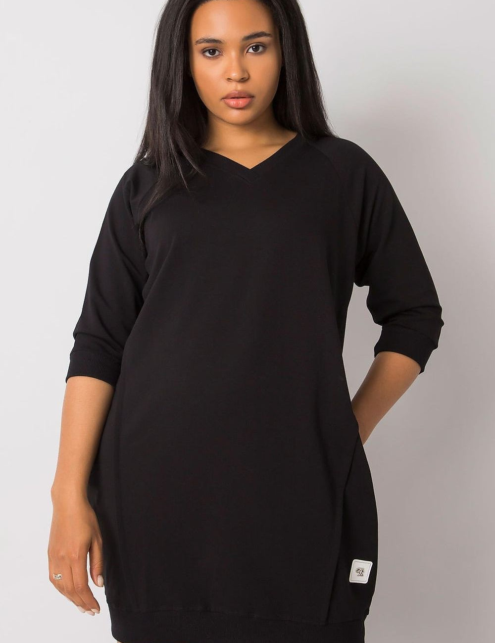 4 sleeves, showcasing classic silhouette and practical side pockets.