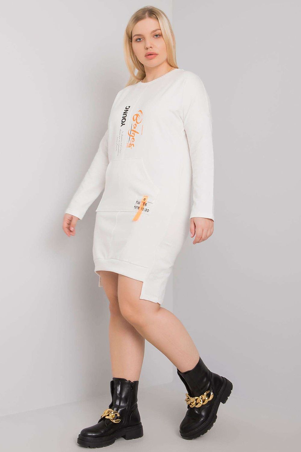 Woman wearing Plus Size Erelvine Pocket Day Dress, white cotton, long sleeves, front pocket, minimalist style.