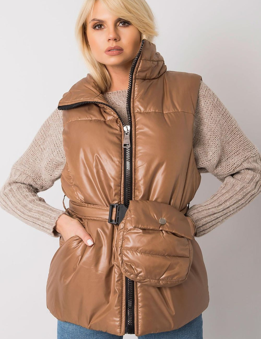Woman wearing brown Calveris Belted Lined Zip Gilet, featuring front zip closure and side pockets, perfect for versatile layering.