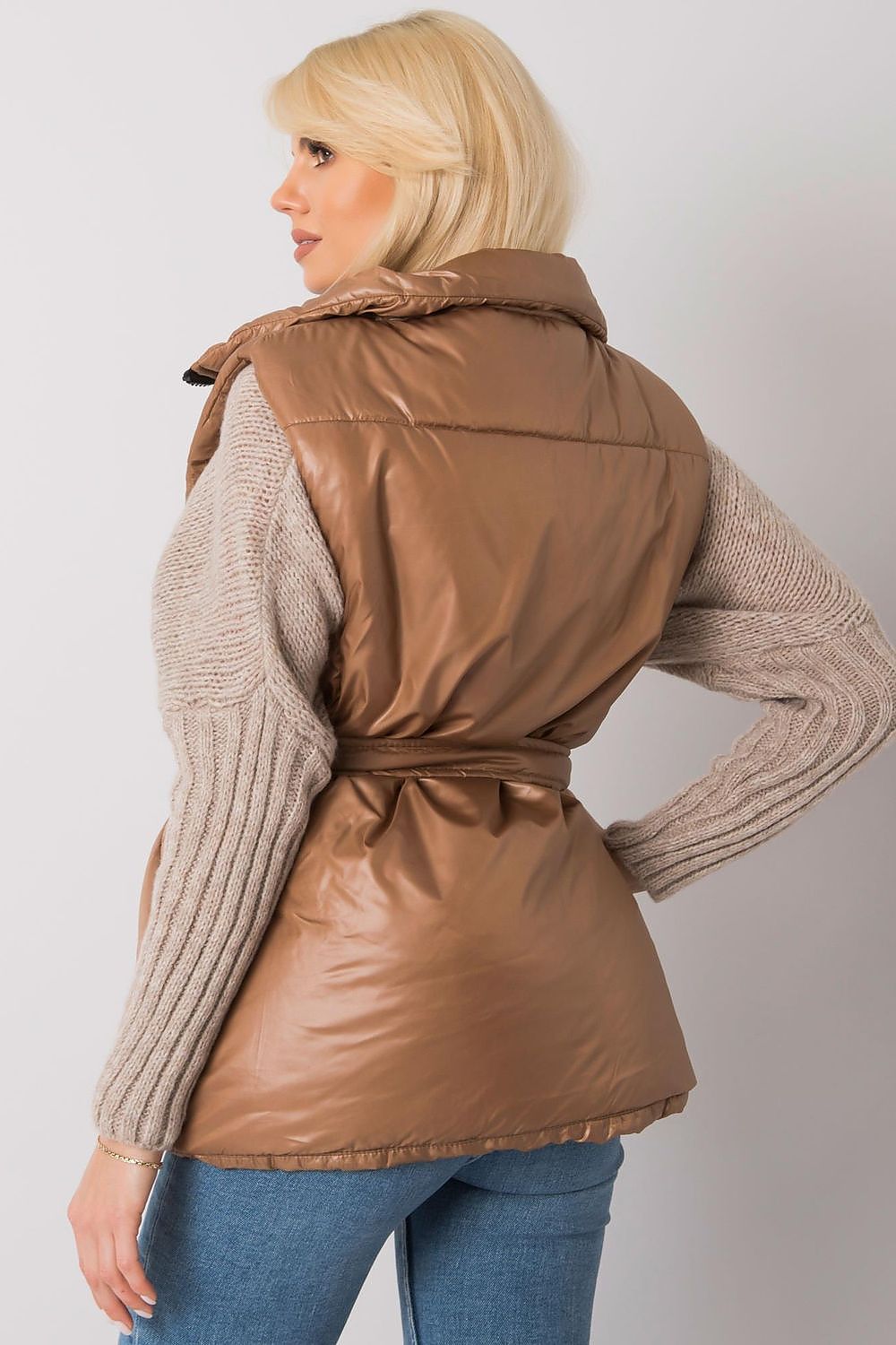 Woman wearing Calveris Belted Lined Zip Gilet in brown, showcasing back view with coordinating belt and smooth lined interior.