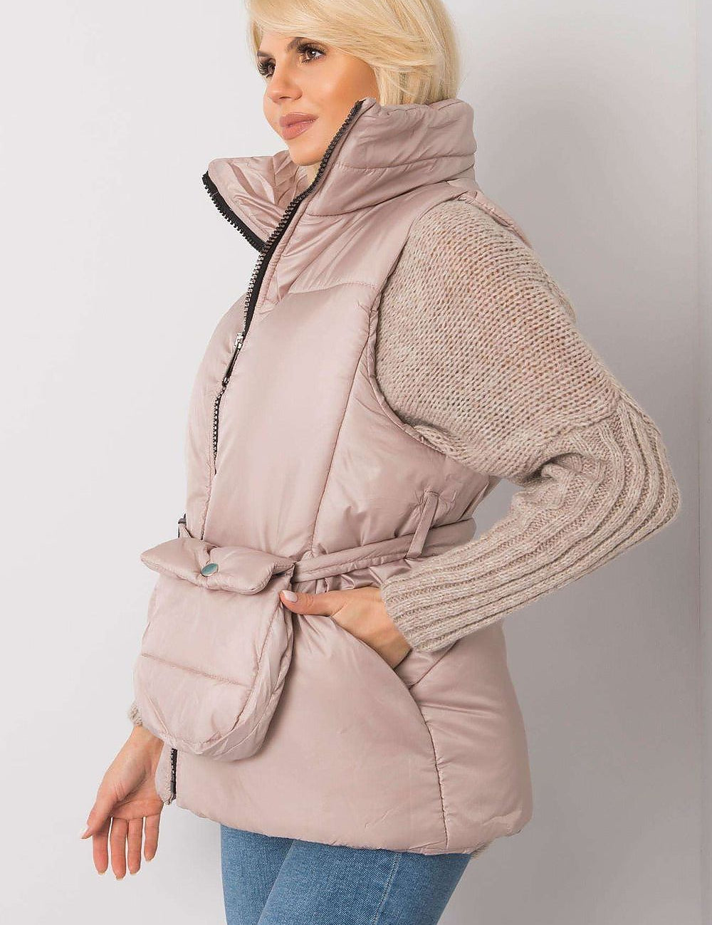 Woman wearing Calveris Belted Lined Zip Gilet, lightweight and sleeveless, with a front zip and side pockets. Perfect for layering.
