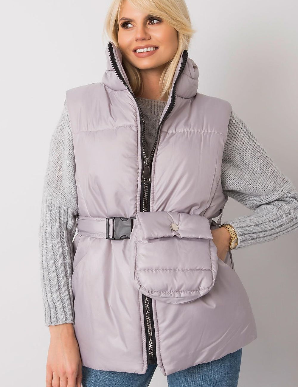 Woman wearing Calveris Belted Lined Zip Gilet, a lightweight sleeveless vest with side pockets and belt, ideal for transitional seasons.