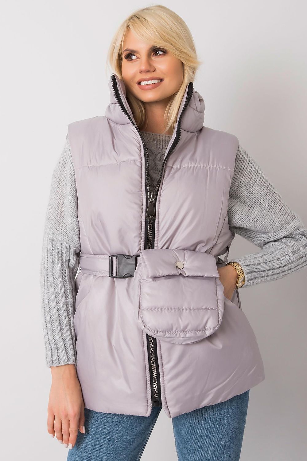 Woman wearing Calveris Belted Lined Zip Gilet, a lightweight sleeveless vest with side pockets and belt, ideal for transitional seasons.