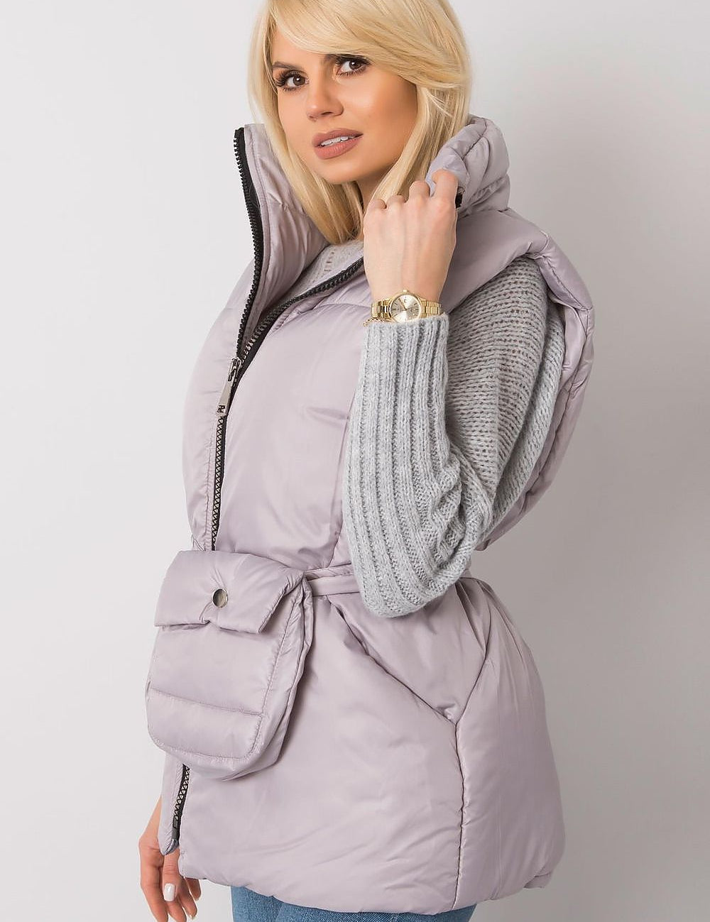 Woman wearing Calveris Belted Lined Zip Gilet with a casual outfit, showcasing front zip and side pockets, highlighting versatility.