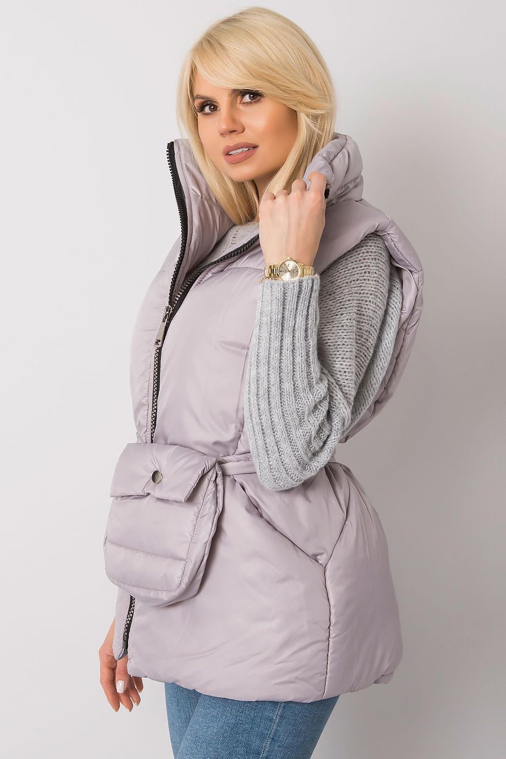 Woman wearing Calveris Belted Lined Zip Gilet with a casual outfit, showcasing front zip and side pockets, highlighting versatility.