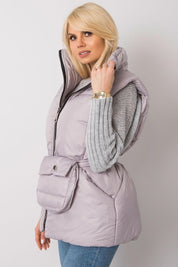 Woman wearing Calveris Belted Lined Zip Gilet with a casual outfit, showcasing front zip and side pockets, highlighting versatility.