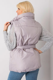 Model wearing Calveris Belted Lined Zip Gilet with coordinating belt, showing back view of lightweight, sleeveless design in lilac color.