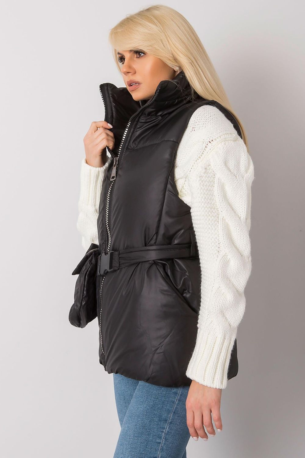 Woman wearing Calveris Belted Lined Zip Gilet in black, showcasing a stylish and versatile sleeveless vest with zip closure and side pockets.