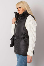 Woman wearing Calveris Belted Lined Zip Gilet in black, showcasing a stylish and versatile sleeveless vest with zip closure and side pockets.