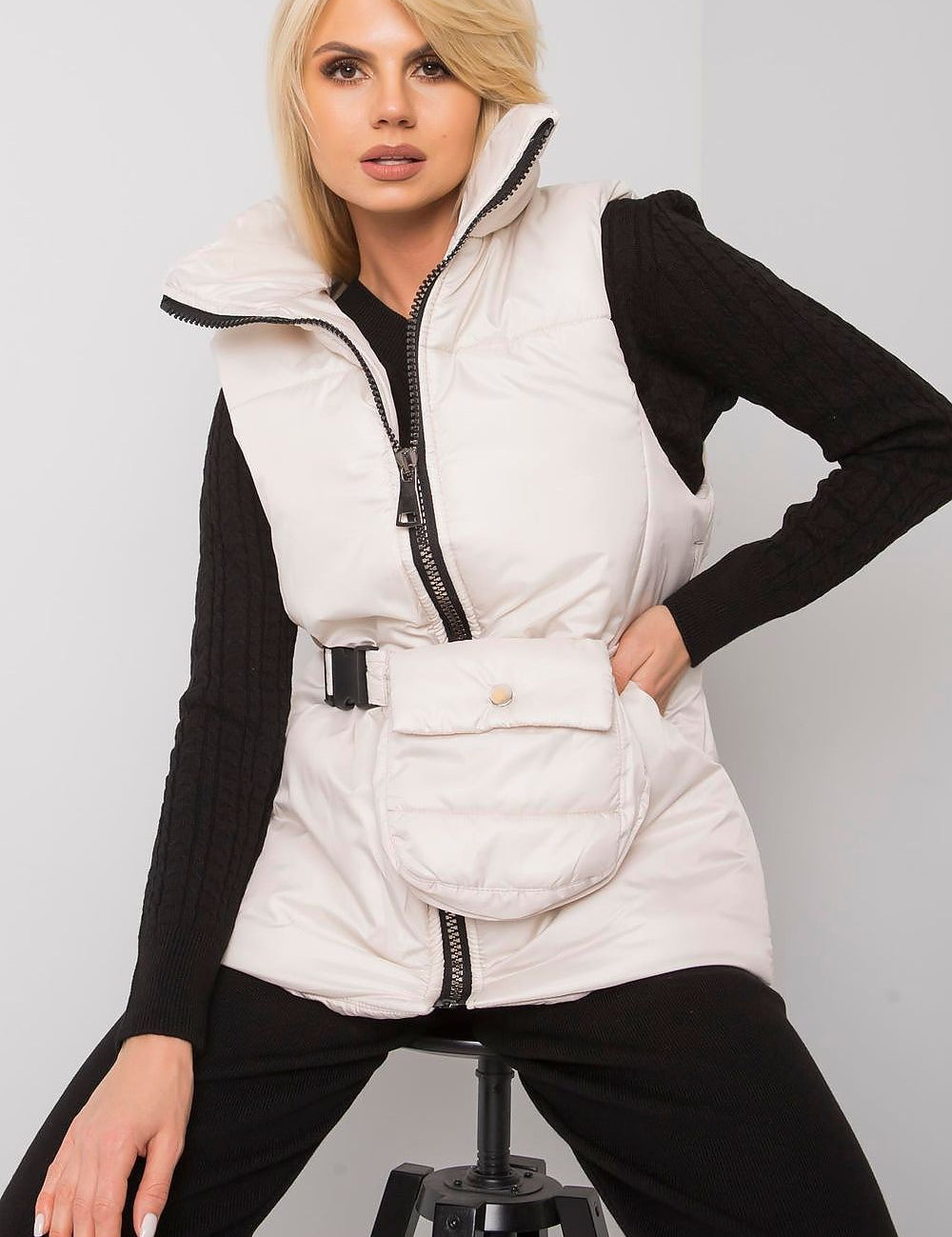 Model wearing Calveris Belted Lined Zip Gilet, showcasing its belted waist and practical side pockets for versatile styling.