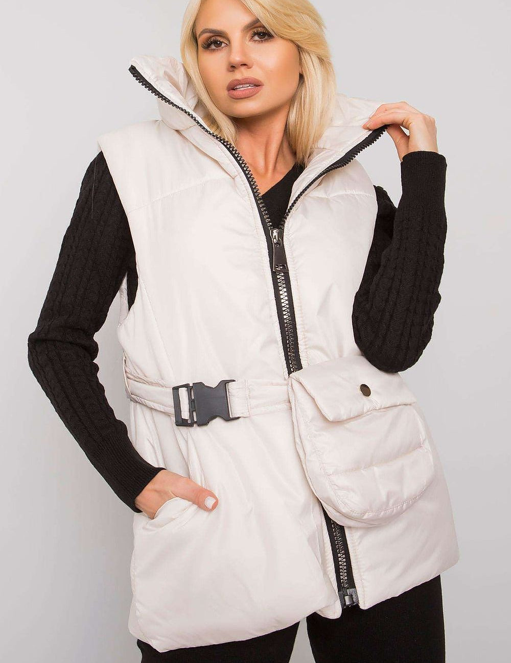 Woman wearing white Calveris Belted Lined Zip Gilet with belt, front zip, and side pockets, ideal for layering in transitional seasons.