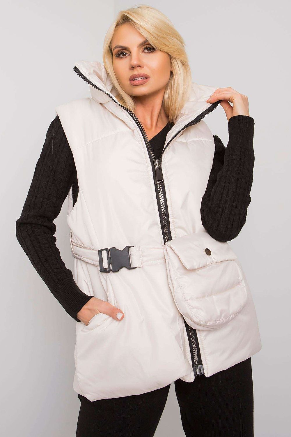 Woman wearing white Calveris Belted Lined Zip Gilet with belt, front zip, and side pockets, ideal for layering in transitional seasons.
