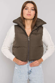 Woman wearing Trevano Khaki Zip Vest layered over a white sweater, featuring a concealed hood and full-length zip closure.