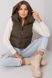 Woman wearing Trevano Khaki Zip Vest with concealed hood, showcasing its lightweight, versatile design for casual and outdoor looks.