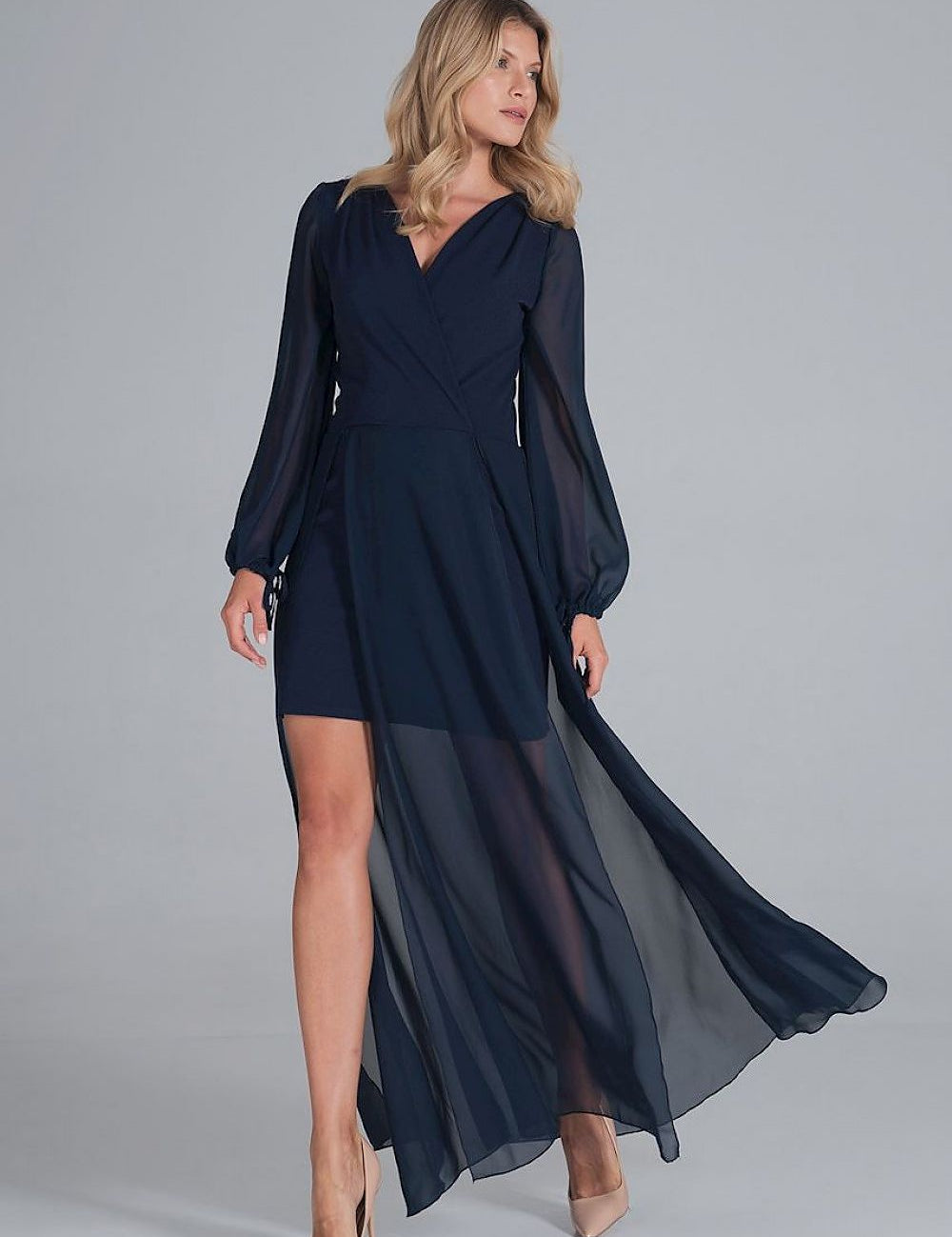Woman wearing Elvianne Chiffon Overlay Gown with envelope neckline, maxi chiffon overlay, and flowing sleeves, ideal for elegant events.