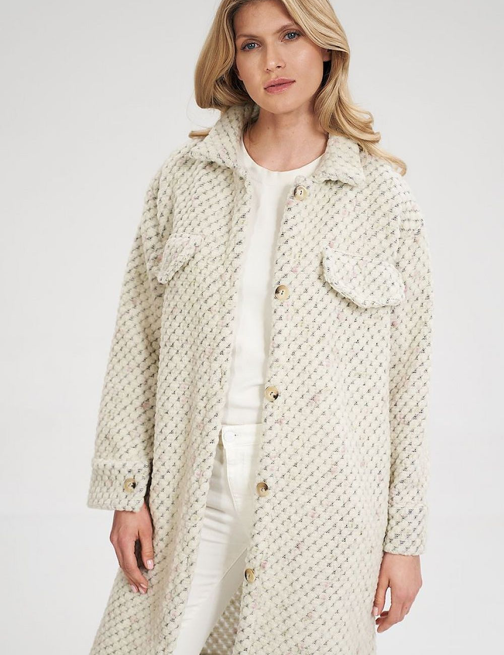 Woman wearing Vallerine Wool-Blend Midi Coat with buttoned front and decorative bust patches, showcasing light unlined design.