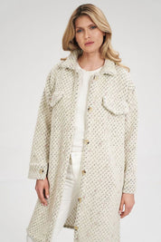 Woman wearing Vallerine Wool-Blend Midi Coat with buttoned front and decorative bust patches, showcasing light unlined design.