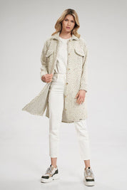Woman wearing Vallerine Wool-Blend Midi Coat with side seam pockets and button cuffs, styled for a transitional season look.
