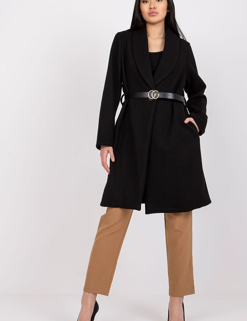 Woman wearing Corvianne Belted Buttoned Coat with side slip pockets and a black belt, showcasing a chic and versatile style.