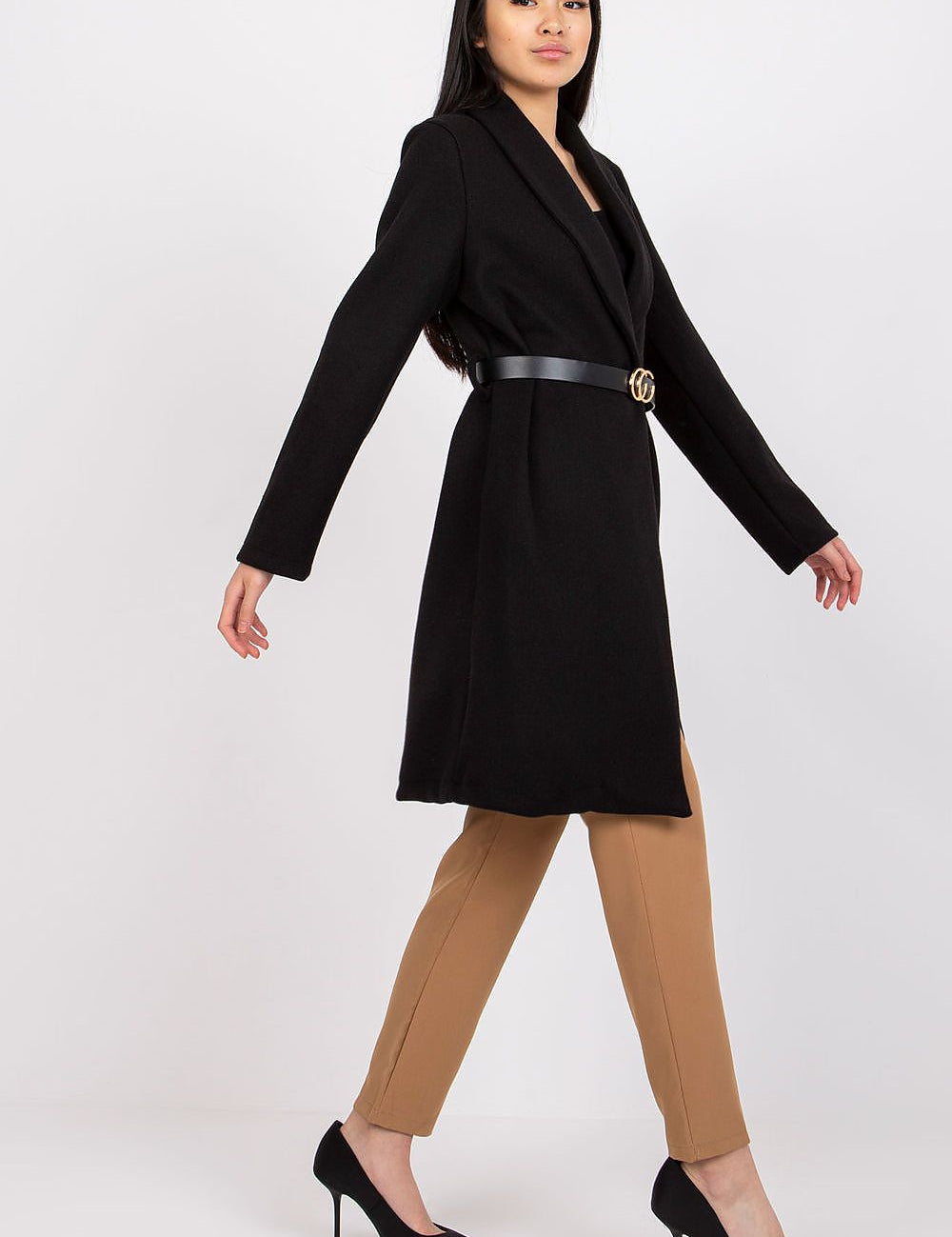 Woman wearing Corvianne Belted Buttoned Coat in black with coordinating belt, showcasing timeless elegance and versatile style.