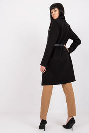 Model wearing Corvianne Belted Buttoned Coat with long sleeves and button closure, showcasing streamlined silhouette and casual elegance.