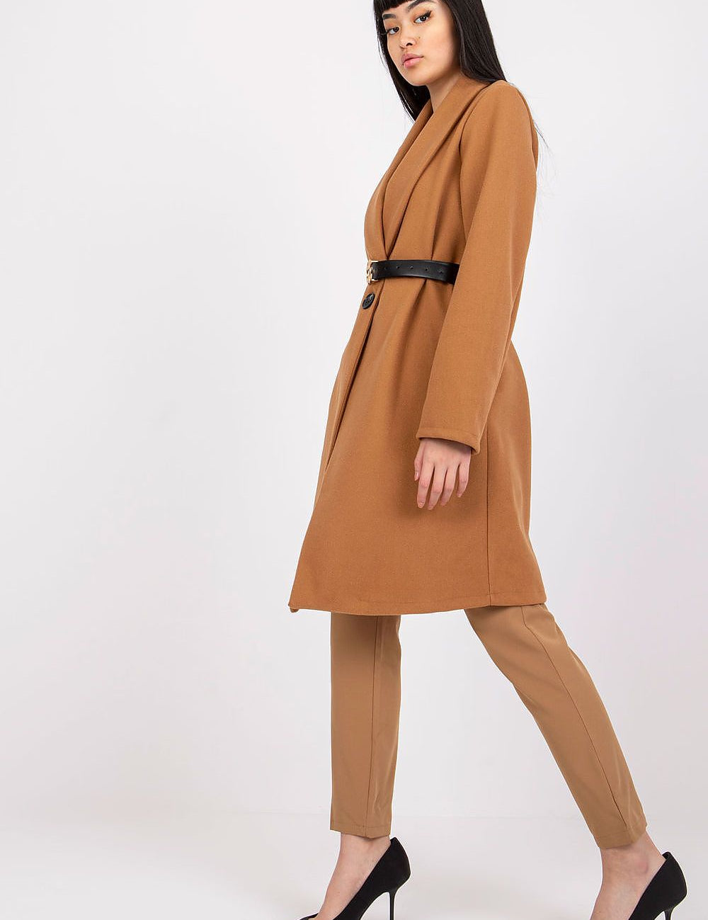 Woman wearing Corvianne Belted Buttoned Coat with sleek silhouette, long sleeves, and side slip pockets; perfect for versatile styling.