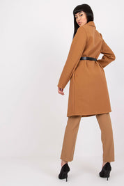 Woman wearing a Corvianne Belted Buttoned Coat, showcasing its elegant design, long sleeves, and waist-cinching belt in a stylish pose.