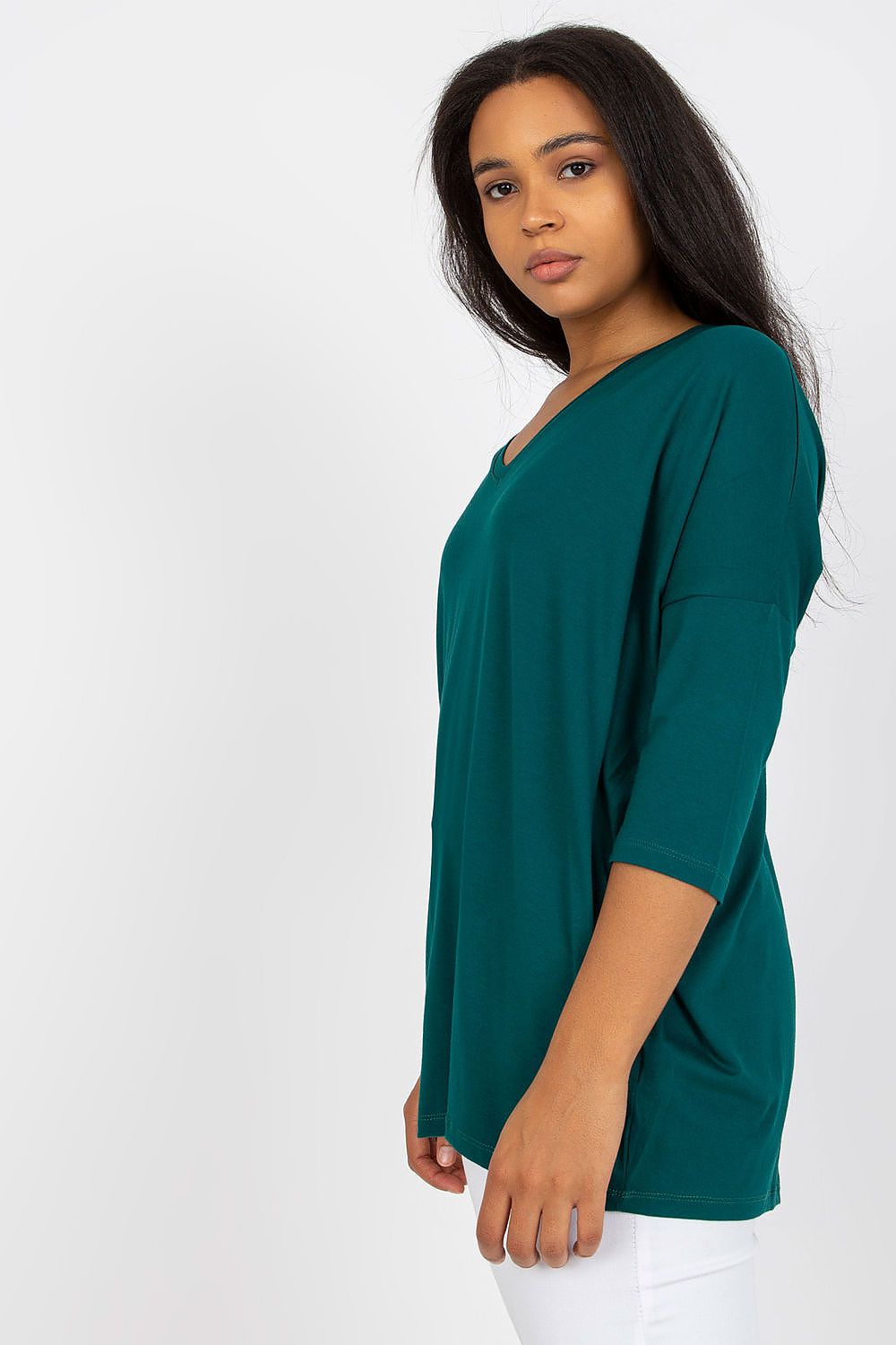 Model wearing a Plus Size Melivora Sweetheart Blouse with a romantic neckline and 3/4 sleeves in a relaxed daytime look.