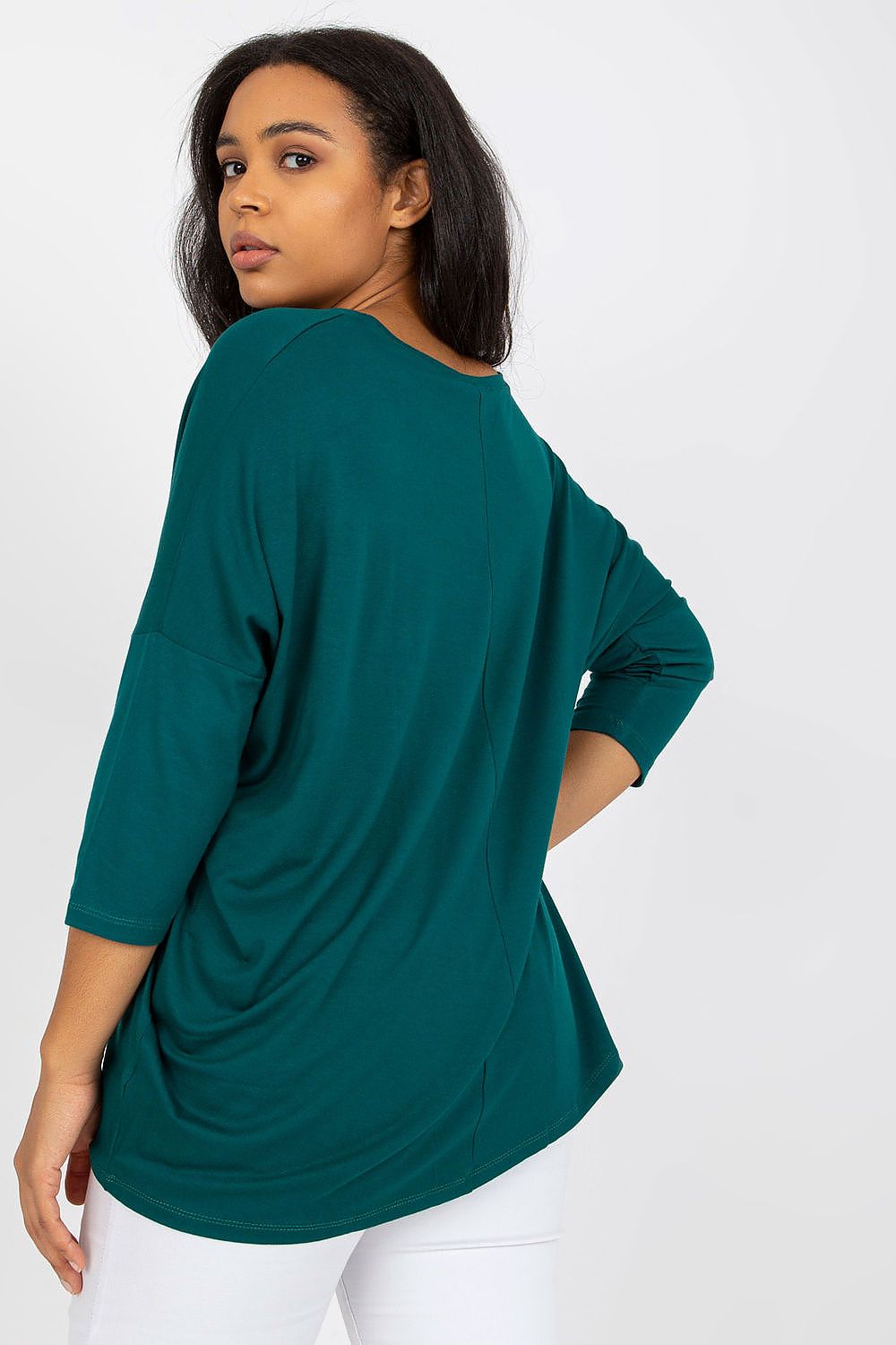 Model wearing Plus Size Melivora Sweetheart Blouse in teal with 3/4 sleeves, showing back view.