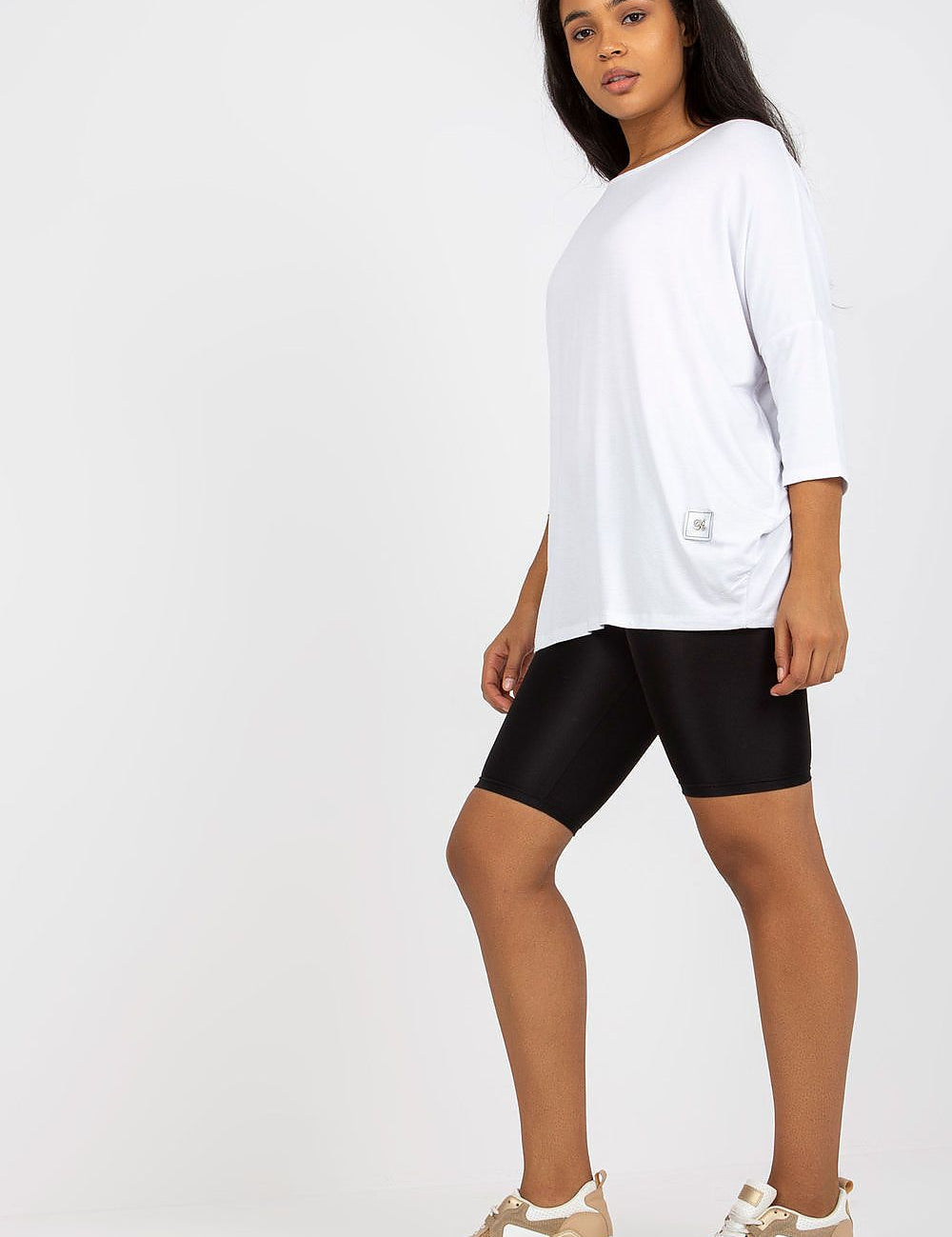 4 sleeves, styled with black shorts and sneakers.