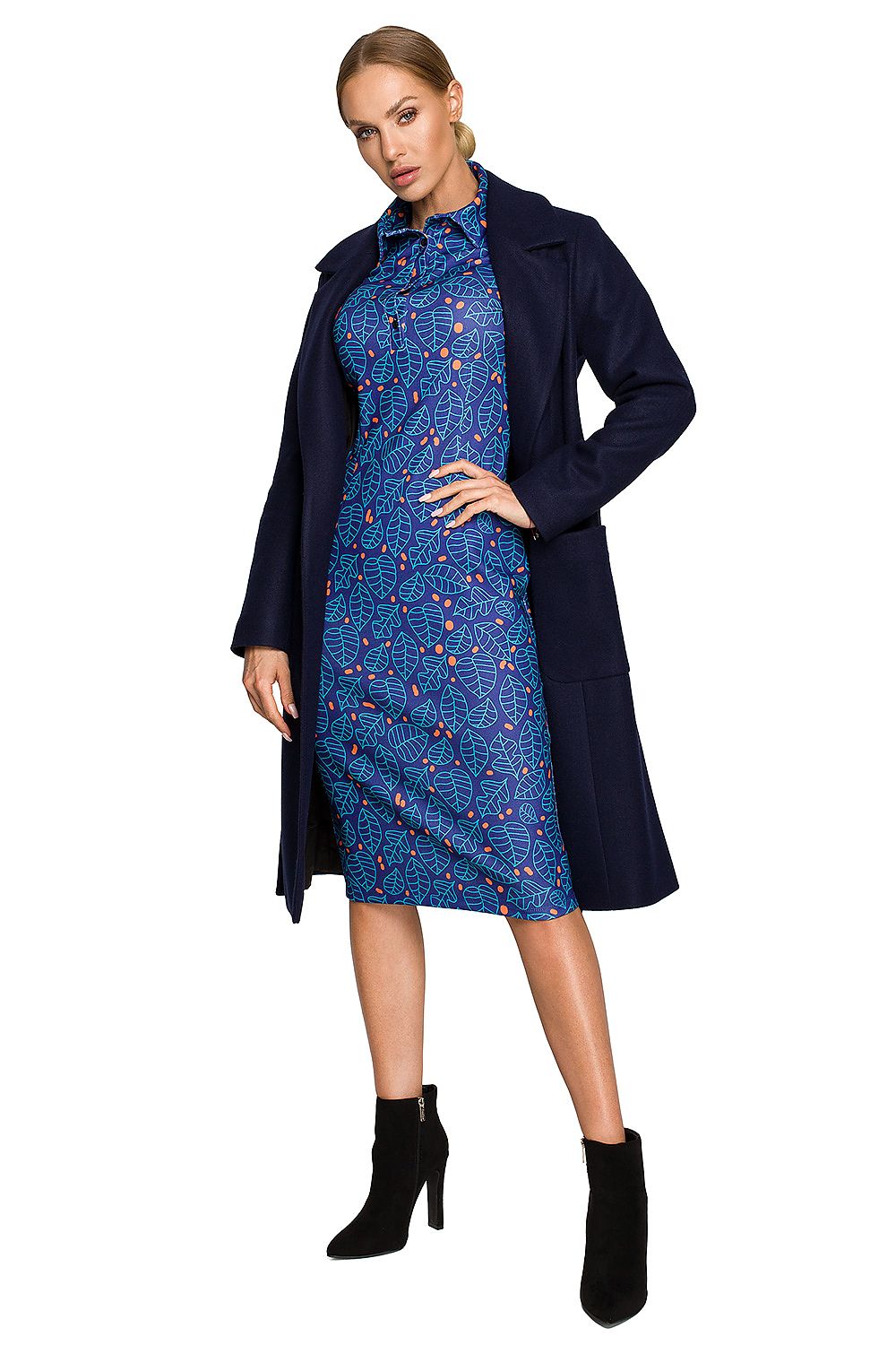 Model wearing Alvenora Belted Fleece Long Coat over blue patterned dress, highlighting classic collar and waist-tie belt.