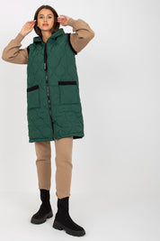 Model wearing Virethia Quilted Hooded Gilet in green, showcasing a casual layered outfit with front sewn-on pockets for transitional weather.