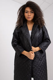 Model wearing Orlianne Quilted Transitional Coat with long sleeves and open quilting, ideal for layered city strolls.