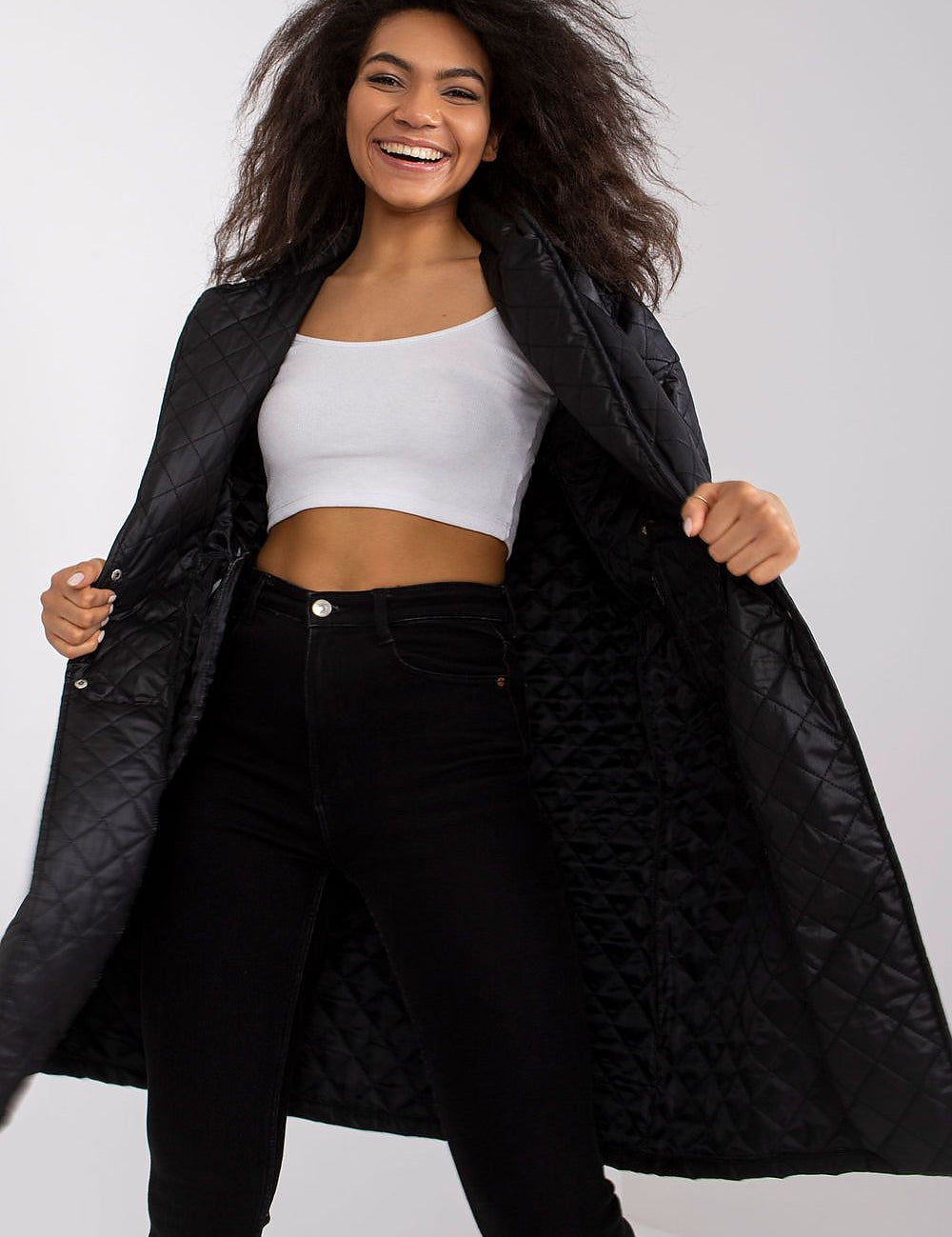 Model wearing Orlianne Quilted Transitional Coat, showcasing its chic silhouette and open quilting, perfect for layered styling.