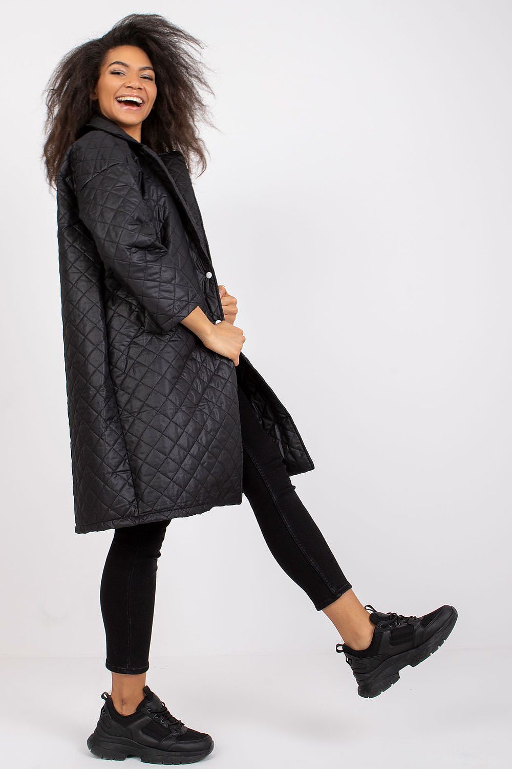 Model wearing Orlianne Quilted Transitional Coat, showcasing its chic silhouette and versatile design for transitional weather.