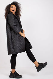 Model wearing Orlianne Quilted Transitional Coat, showcasing its chic silhouette and versatile design for transitional weather.