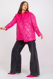 Woman wearing pink Cerenya quilted jacket with extended back, featuring press-stud front and side slip pockets, styled with black pants.