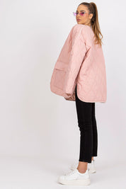 Model wearing Elenique pink quilted jacket with press studs, long sleeves, and pockets, perfect for transitional seasons.